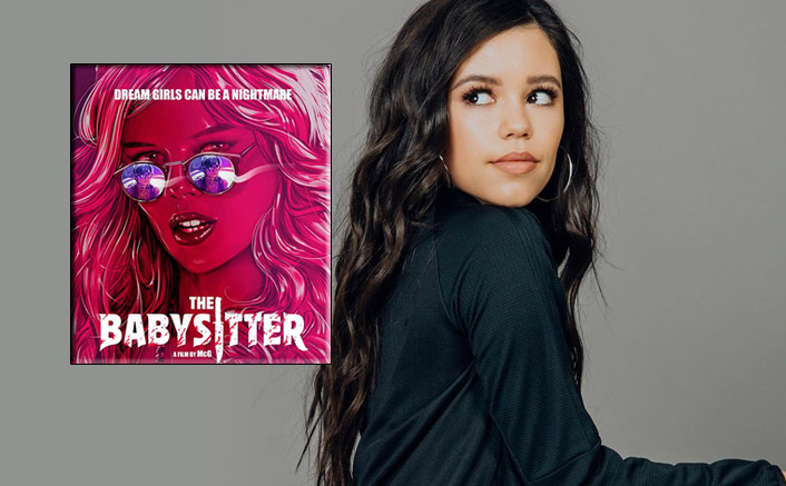 jenna wearing a greenish sweatshirt and hoops side eyeing the babysitter movie poster 