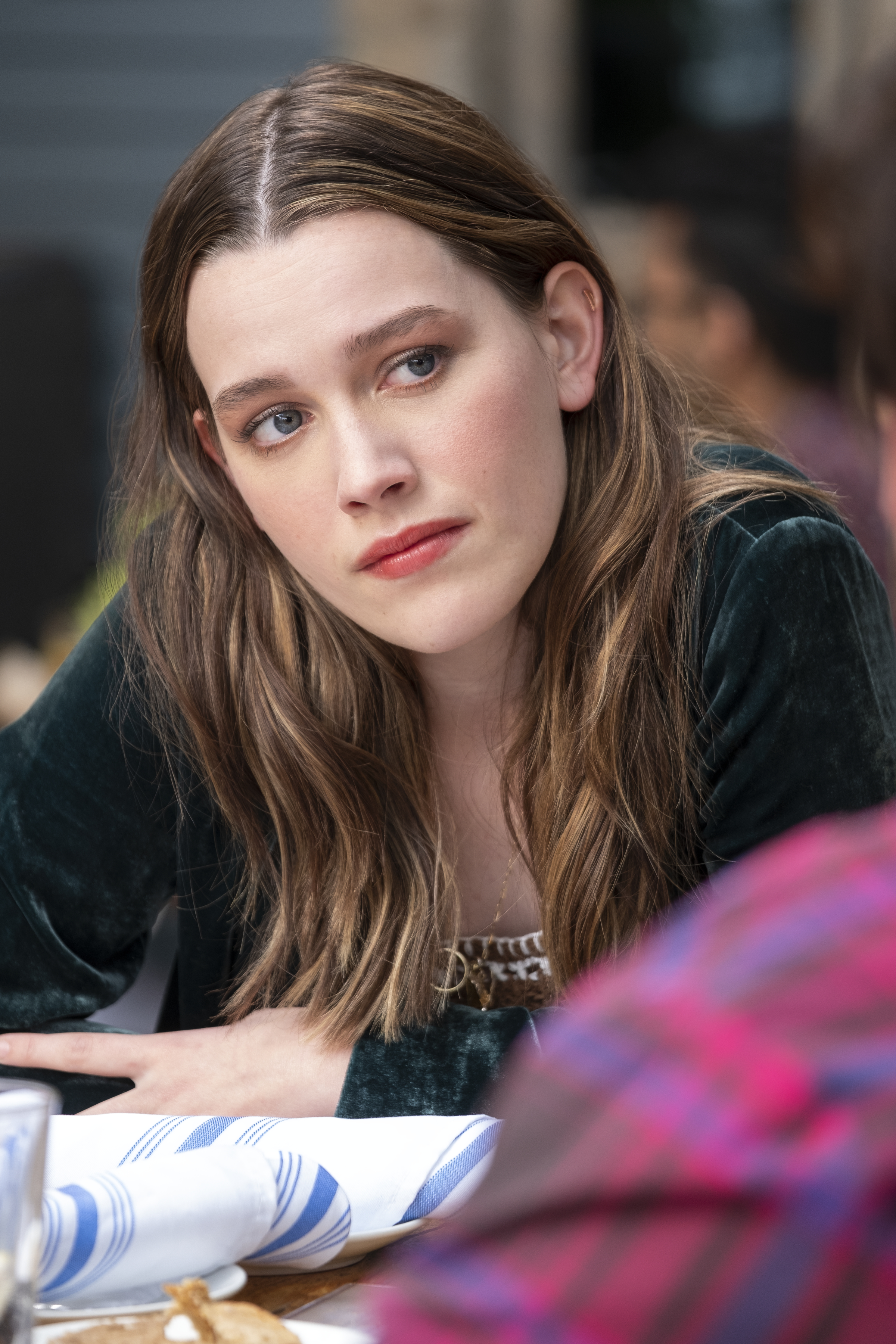 love wearing a green top looking at her friend