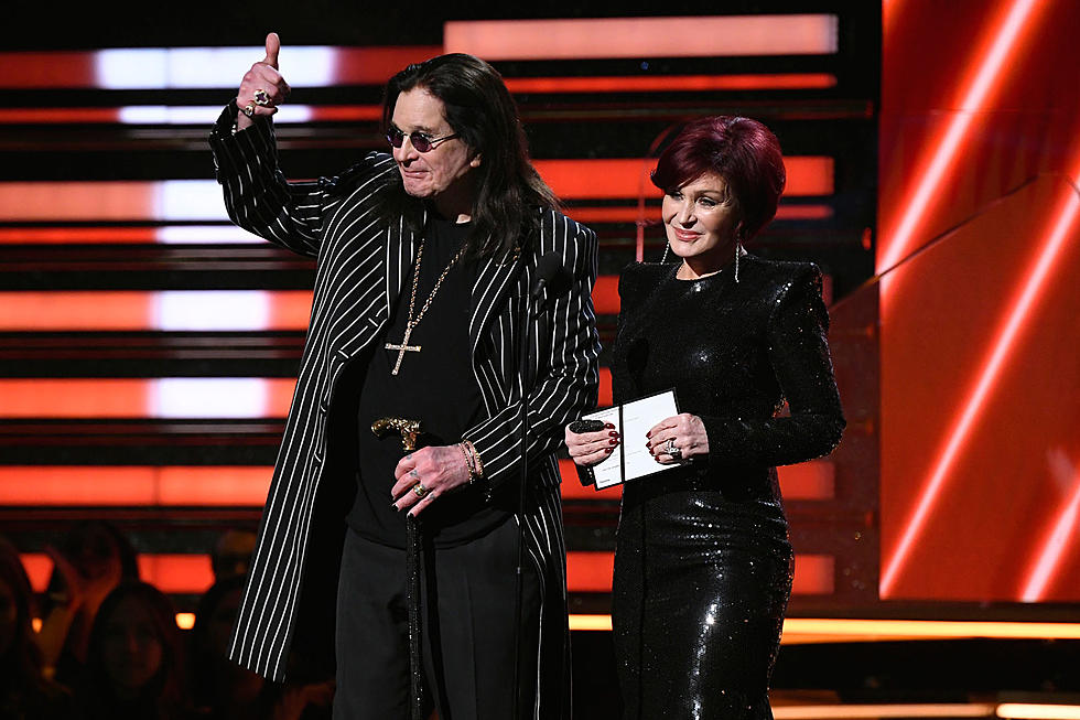 ozzy with wife sharon on stage announcing awards 