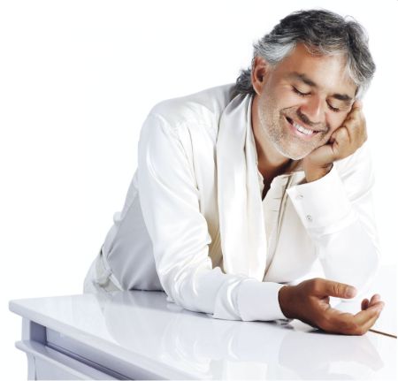 Andrea Bocelli poses in all white attire. His net worth is $40 million.  