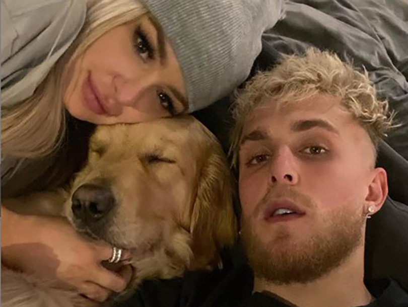 tana jake and dog thor lying down on the bed