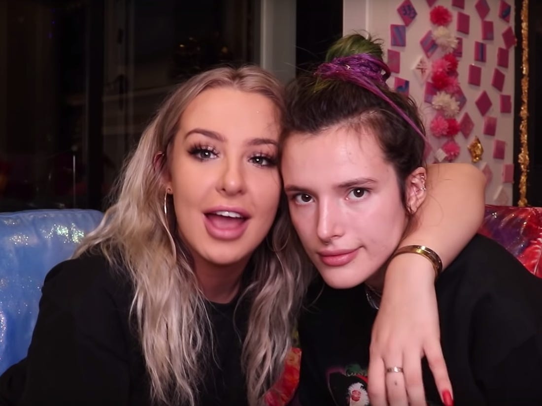 tana hugging bella with her hand around bella's shoulder 