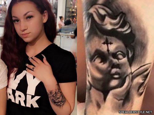 cherub tattoo on her right arm 