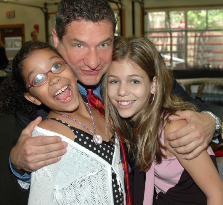 Rick Leventhal poses a picture with his two daughters.