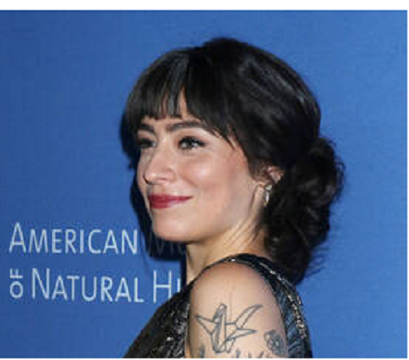 Melissa also has an origami swan tattoo on her arm.