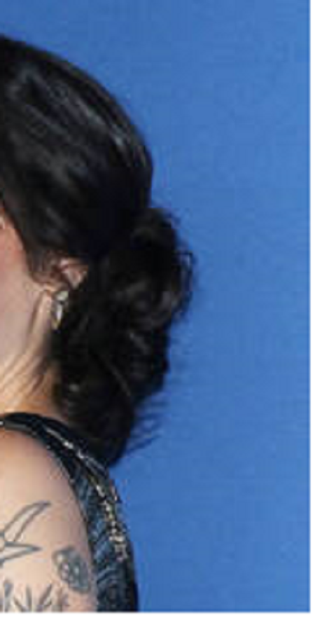 Melissa also has the tattoo of the atom on the back of her upper arm.