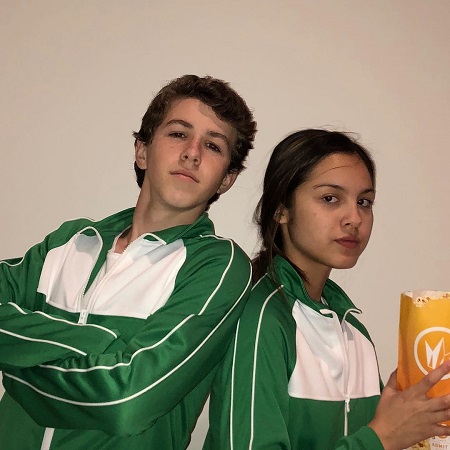 Olivia Rodrigo and Ethan Wacker in matching tracksuits.