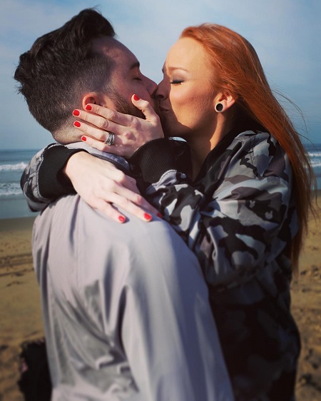 Taylor McKinney and Maci Bookout kissing following their engagement.