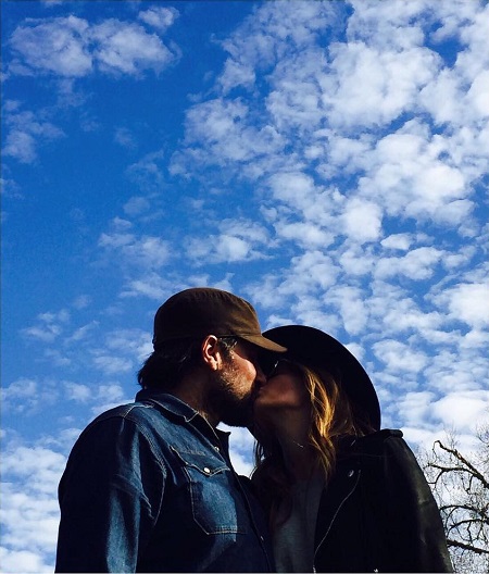 Stana Katic and husband Kris Brkljac kissing each other on New Year 2017.