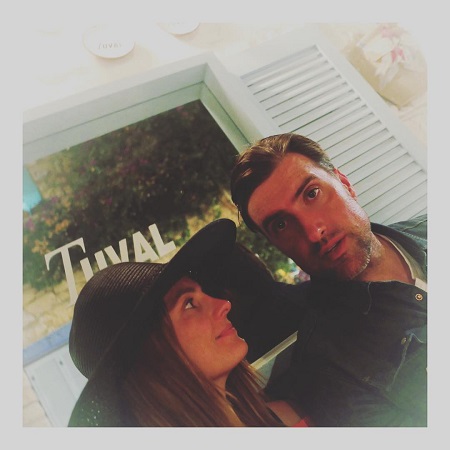 Stana Katic and husband Kris Brkljac in a romantic pose.