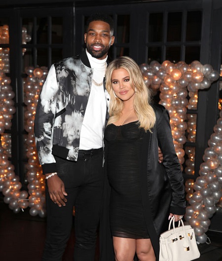 Tristan Thompson with a pregnant Khloe Kardashian.