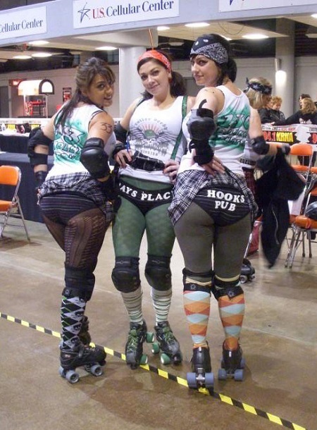 Danielle (right) along with Moly Tov (left) and Danielle’s younger sister, Carbomb Betty showing off their advertising assets prior to a Mickies match
