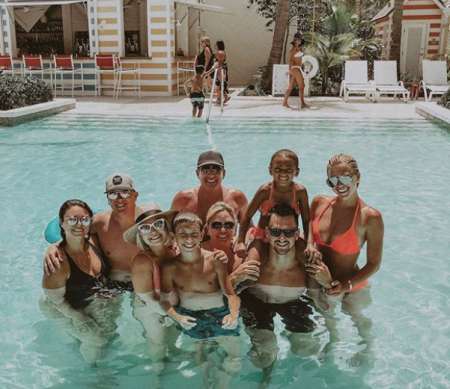 Julie Chrisley enjoying at pool with her husband, son and daughters.