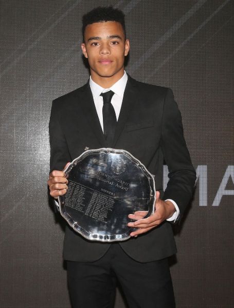 Mason Greenwood is showing his award.