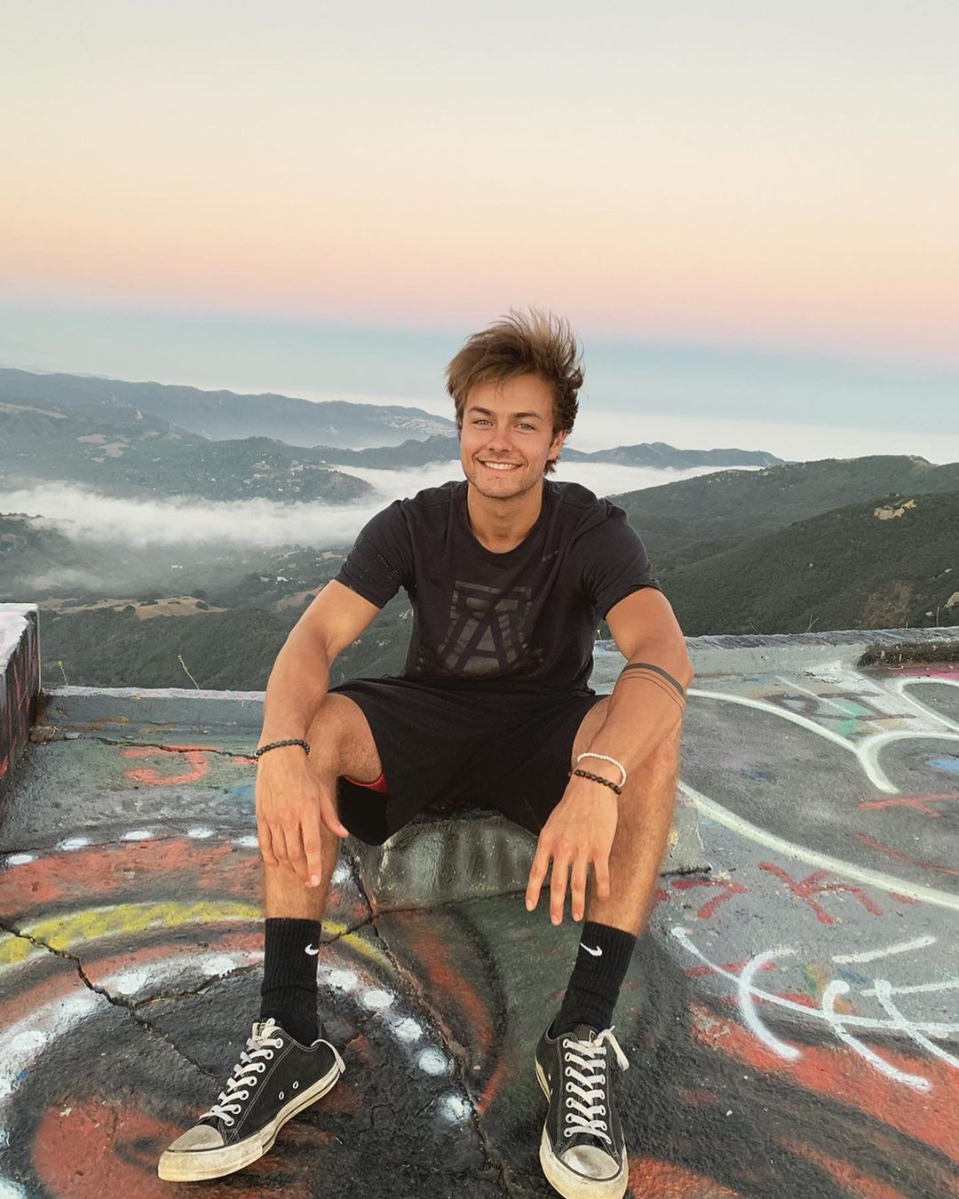 Peyton Meyer is posing for his post.