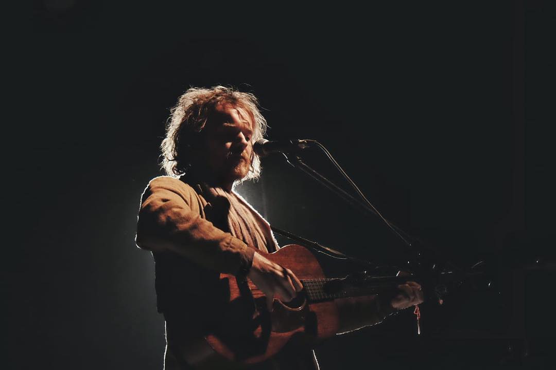 Damien Rice is in the middle of his concert.