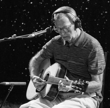 Eric Clapton is playing guitar.