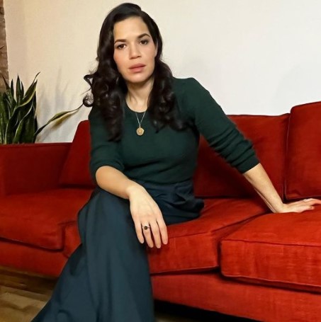 America Ferrera in 2016 wearing a trenchcoat.