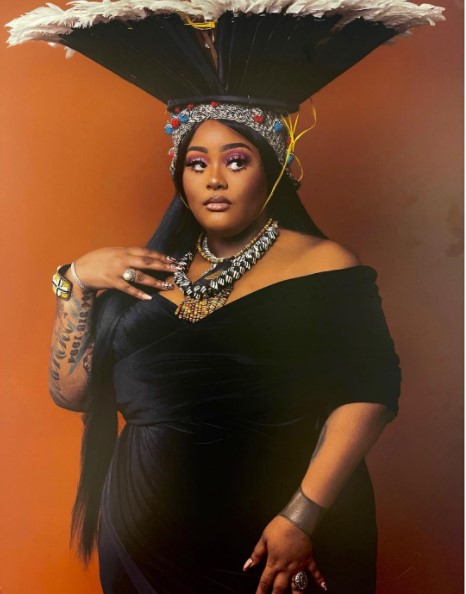 tokyo sitting on a chair with long hair 