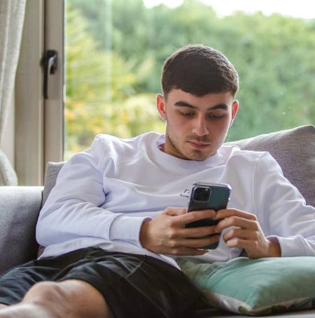 Pedri is looking at his phone.